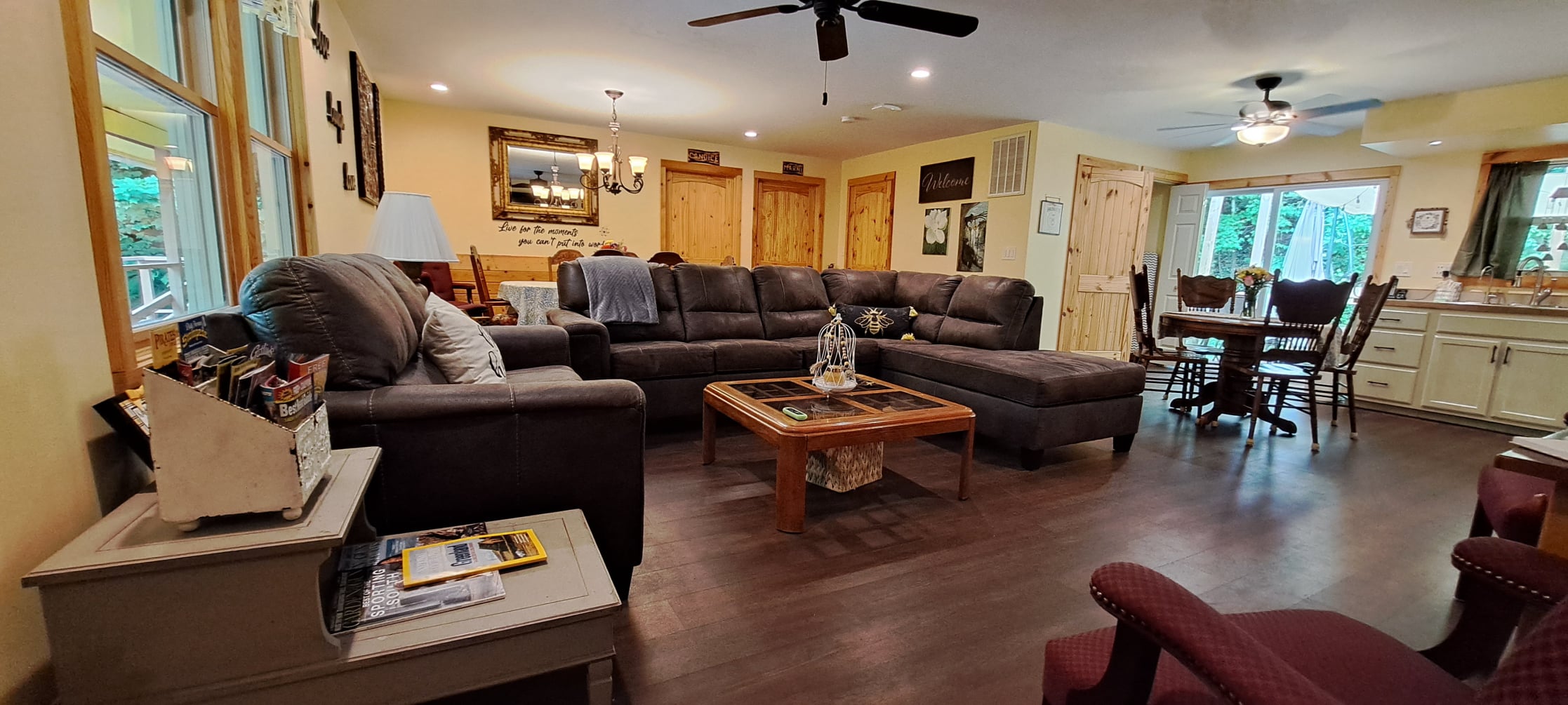 Open living room, dining table, and kitchen on one level at Honey Hive Hideaway
